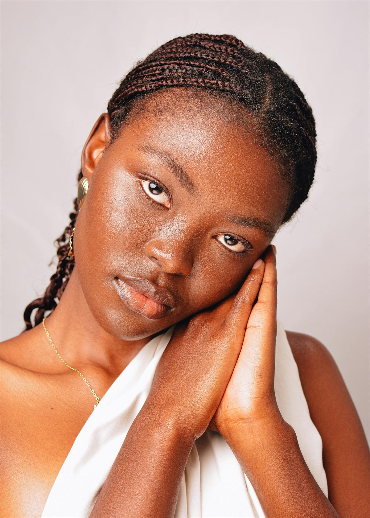 Corn rows hairstyle by Favor Hair Braiding in Stone Mountain, Georgia