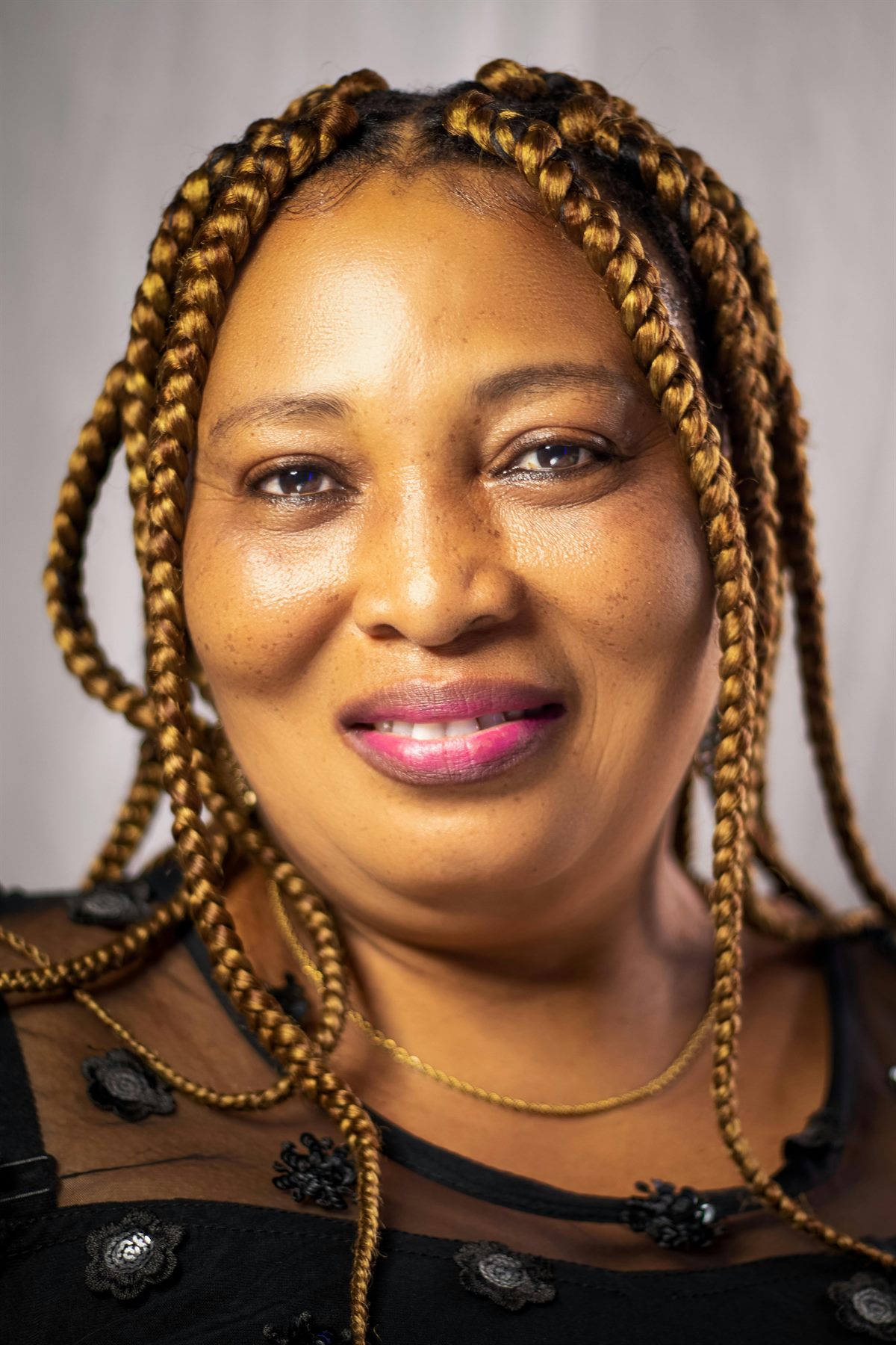 Braided hairstyle with neat finishing at a Stone Mountain braiding salon